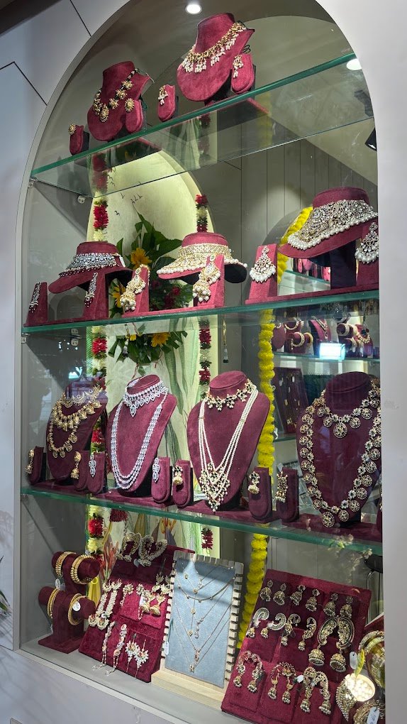 Arched glass display case with bridal sets